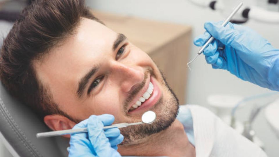 Dentist Treating Patient In Dental Office