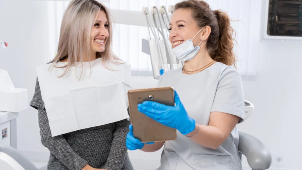 Dentist Showing A Treatment Plan To A Patient