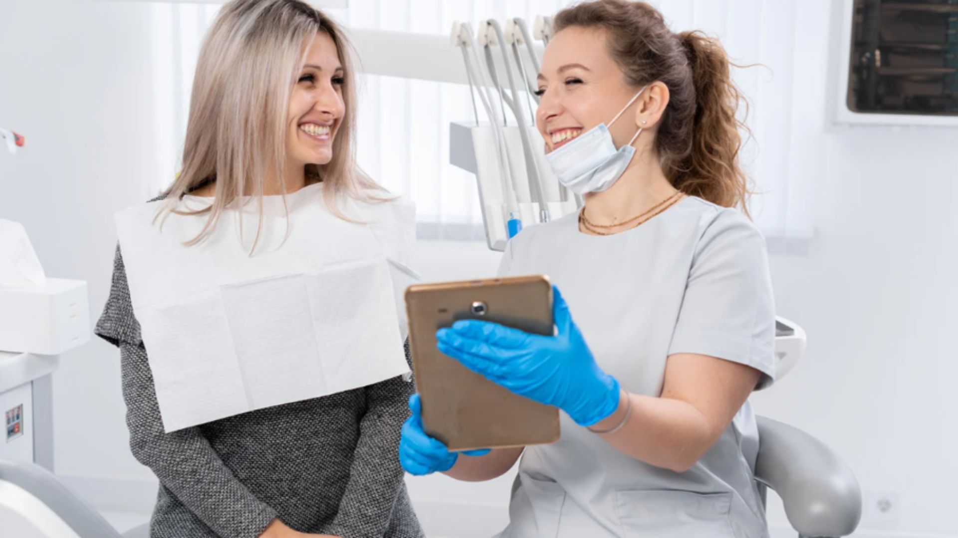 Dentist Showing A Treatment Plan To A Patient